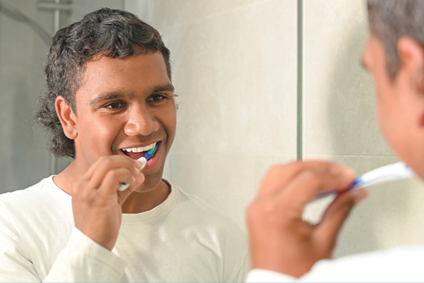 Youth brushing teeth